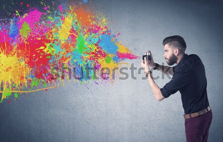 Painter working with airbrush and paints colorful paint Stock photo © ra2studio