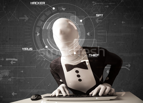 Stock photo: Hacker without identity in futuristic enviroment hacking personal information on tech background