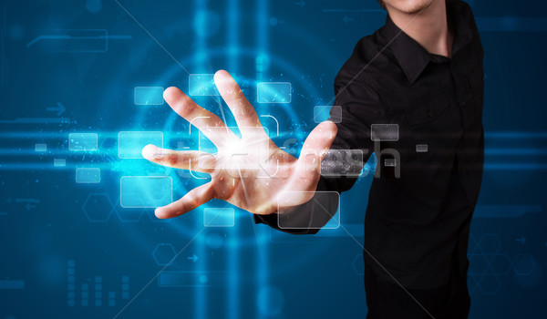 Businessman pressing high tech type of modern buttons  Stock photo © ra2studio