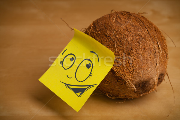 Post-it note with smiley face sticked on a coconut Stock photo © ra2studio