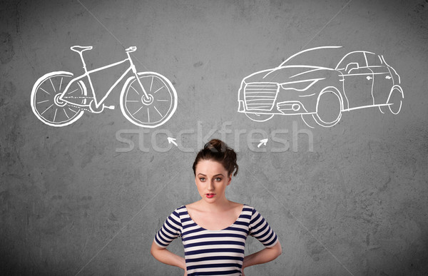 Woman making a choice between bicycle and car Stock photo © ra2studio