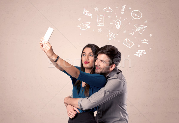 Stock photo: Couple taking selfie with thoughts illustrated