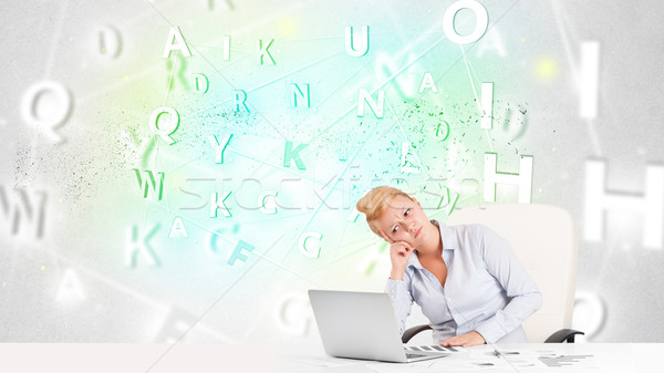 Business woman at desk with green word cloud Stock photo © ra2studio