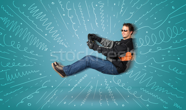Funny guy drives an imaginary vehicle with drawn lines around hi Stock photo © ra2studio