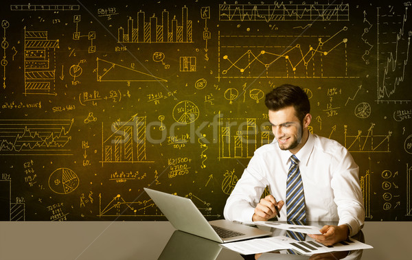 Businessman with diagram background Stock photo © ra2studio