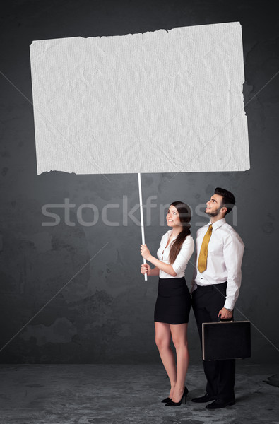 Business couple with blank booklet paper Stock photo © ra2studio