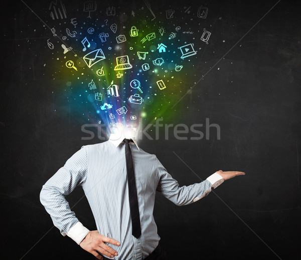 Business man with glowing media icons exploding head  Stock photo © ra2studio