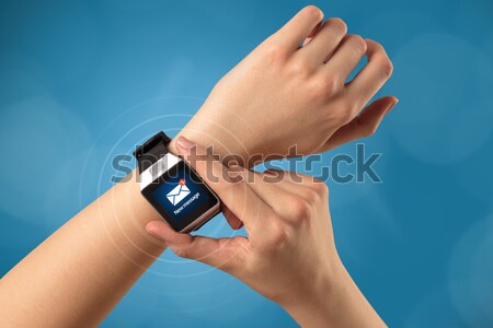 Hand with smartwatch Stock photo © ra2studio