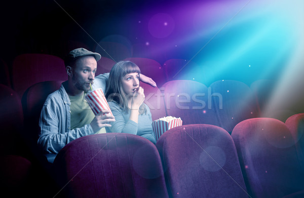 Teenager couple watching movie  Stock photo © ra2studio