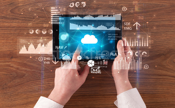 Hand holding tablet and checking finantial report concept Stock photo © ra2studio