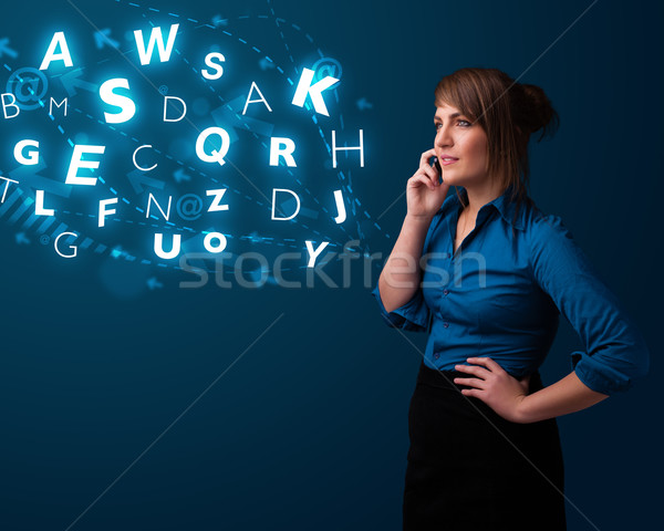 Young lady making phone call with shiny characters Stock photo © ra2studio
