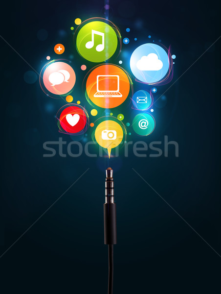 Social media icons coming out of electric cable Stock photo © ra2studio