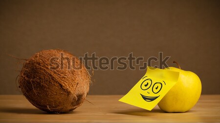 Apple with post-it note looking at avocado Stock photo © ra2studio