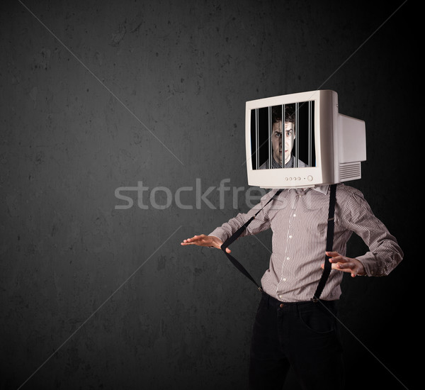 Stock photo: Business man with monitor on his head traped into a digital syst