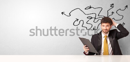 Businessman sitting in front of a wall with copy space Stock photo © ra2studio