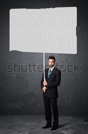 üzletember füzet papír fiatal tart nagy Stock fotó © ra2studio