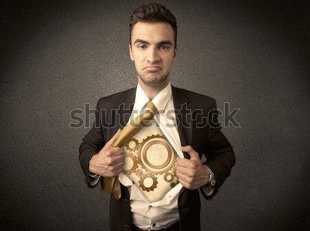 Businessman tearing shirt off and machine cog wheel shows Stock photo © ra2studio