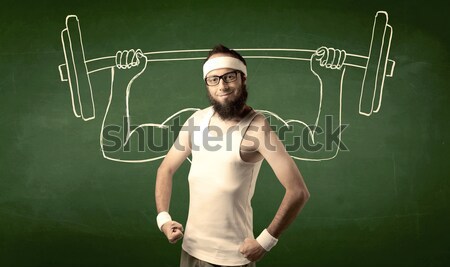 Young man lifting weight Stock photo © ra2studio