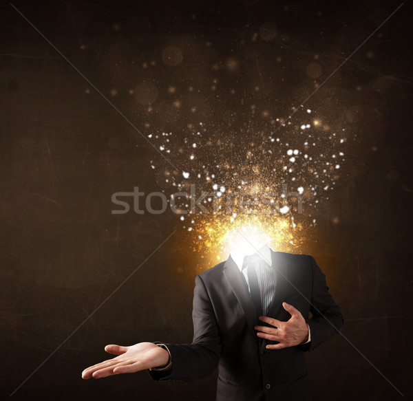 Business man with glowing exploding head Stock photo © ra2studio