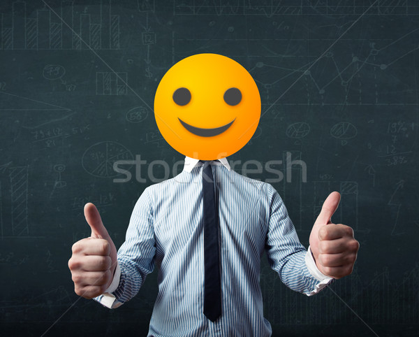 businessman wears yellow smiley face Stock photo © ra2studio