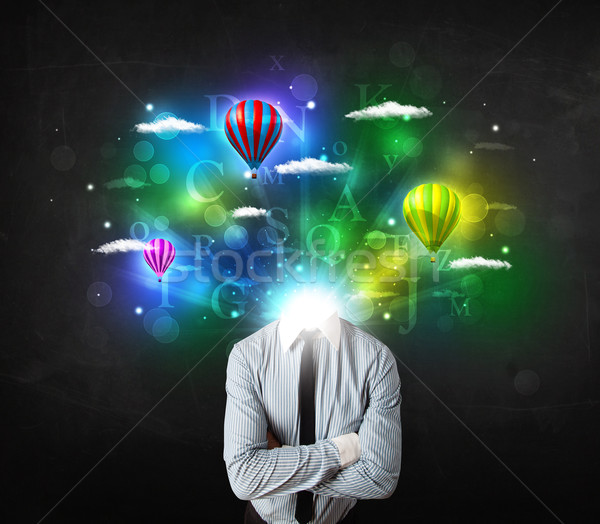 Man in suit with dreamy cloudscape concept Stock photo © ra2studio