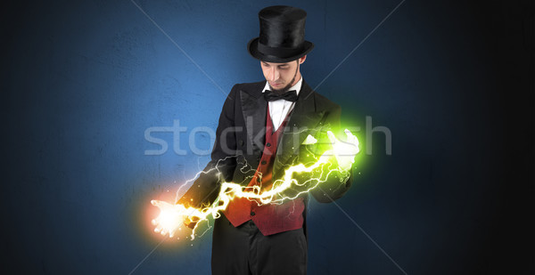 Magician energy between his hands Stock photo © ra2studio