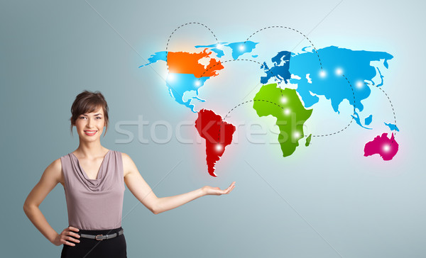 Young woman presenting colorful world map Stock photo © ra2studio