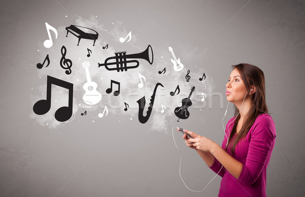 Beautiful young woman singing and listening to music with musical notes and instruments Stock photo © ra2studio