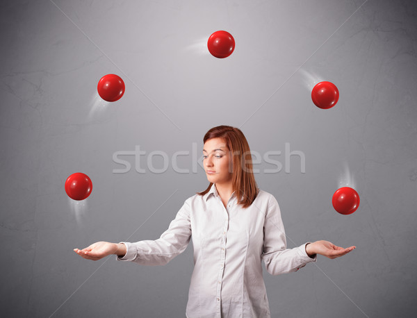 Młoda dziewczyna stałego żonglerka czerwony dość Zdjęcia stock © ra2studio