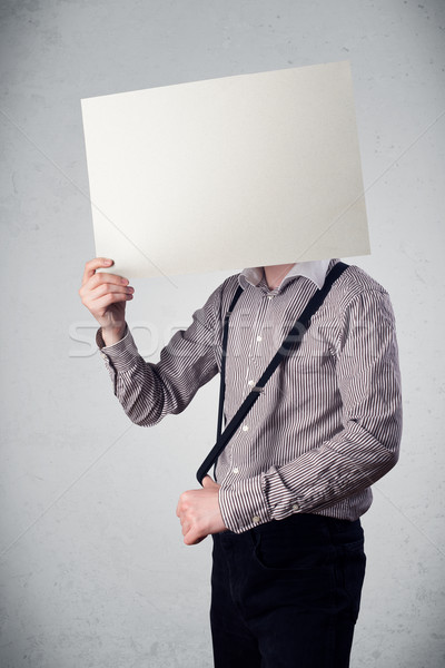Geschäftsmann halten Kopf Papier Kopie Raum stehen Stock foto © ra2studio