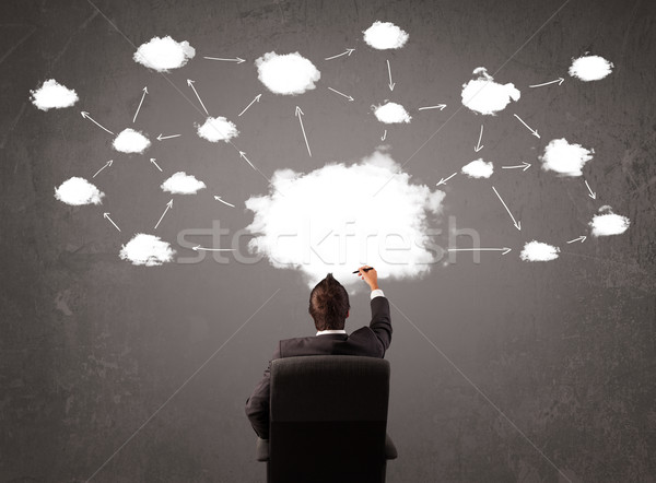 Stock photo: Businessman sitting with cloud technology above his head