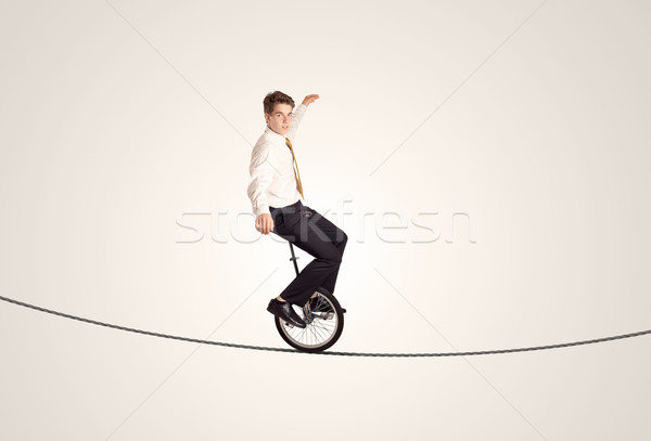 Extreme деловой человек верховая езда одноколесном велосипеде веревку человека Сток-фото © ra2studio