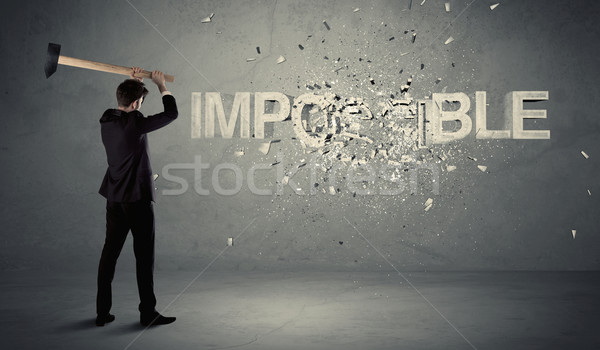 Hombre de negocios imposible signo martillo sucio pared Foto stock © ra2studio