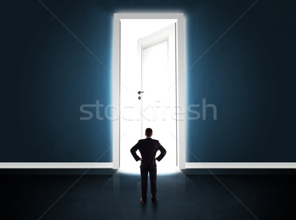 деловой человек глядя большой ярко двери Сток-фото © ra2studio