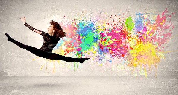 Felice adolescente jumping colorato inchiostro splatter Foto d'archivio © ra2studio