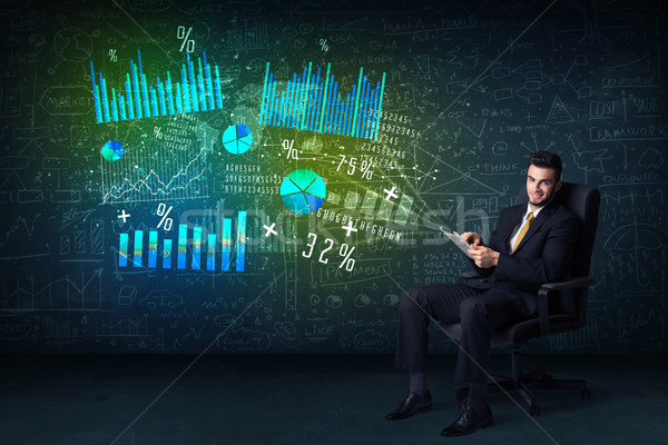 Businessman in office chair with tablet in hand and high tech gr Stock photo © ra2studio