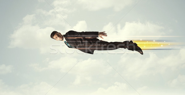 Foto stock: Feliz · homem · de · negócios · voador · rápido · céu · nuvens