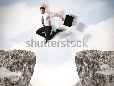 Vicces üzletember ugrik kövek hézag üzlet Stock fotó © ra2studio