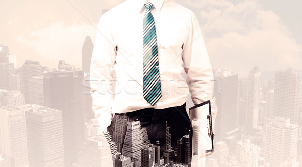 Handsome business man with overlay cityscape Stock photo © ra2studio