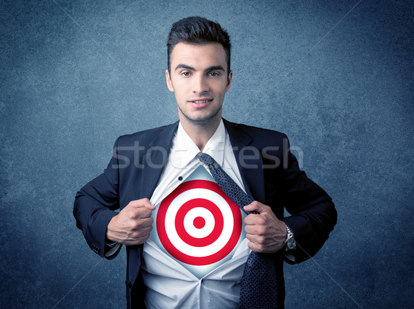 Businessman tearing shirt with target sign on his chest Stock photo © ra2studio