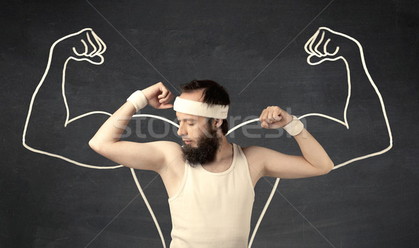Young weak man with drawn muscles Stock photo © ra2studio