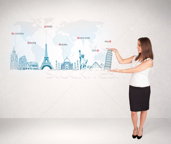 Business woman presenting map with famous cities and landmarks Stock photo © ra2studio