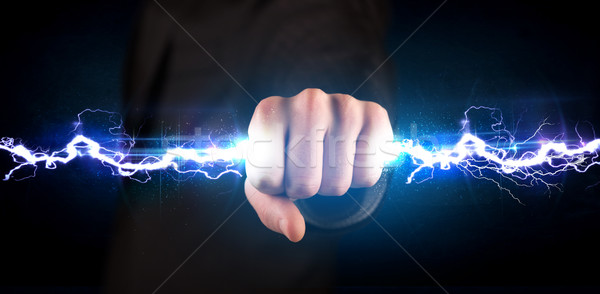 Homme d'affaires électricité lumière mains [[stock_photo]] © ra2studio