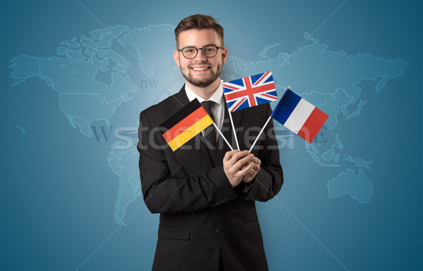 Man standing with flag and map background Stock photo © ra2studio