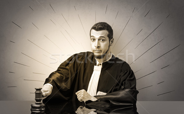 Oldscool young judge in gown deciding Stock photo © ra2studio