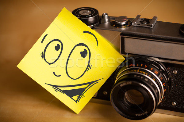 Post-it note with smiley face sticked on photo camera Stock photo © ra2studio