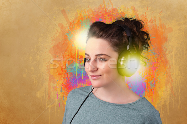 Young woman with headphones listening to music Stock photo © ra2studio