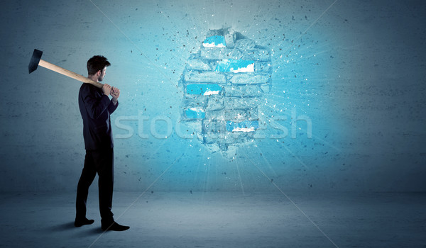 Business man hitting brick wall with huge hammer Stock photo © ra2studio