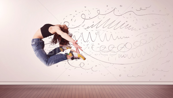 Stock photo: Pretty woman jumping with hand drawn lines and arrows come out