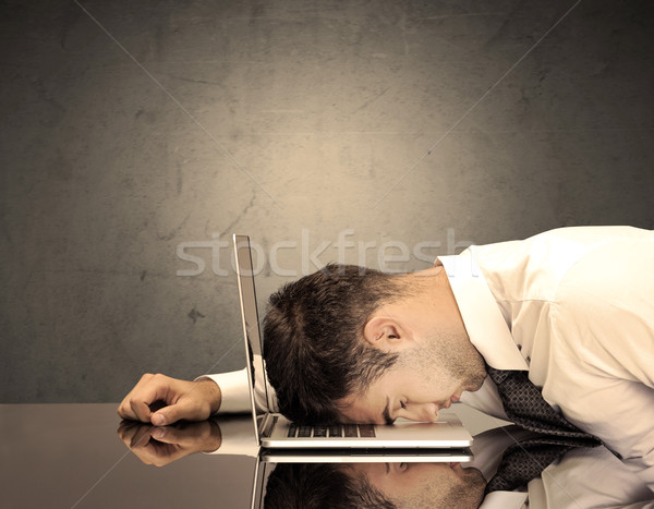 Frustrated businessman's head on keyboard Stock photo © ra2studio